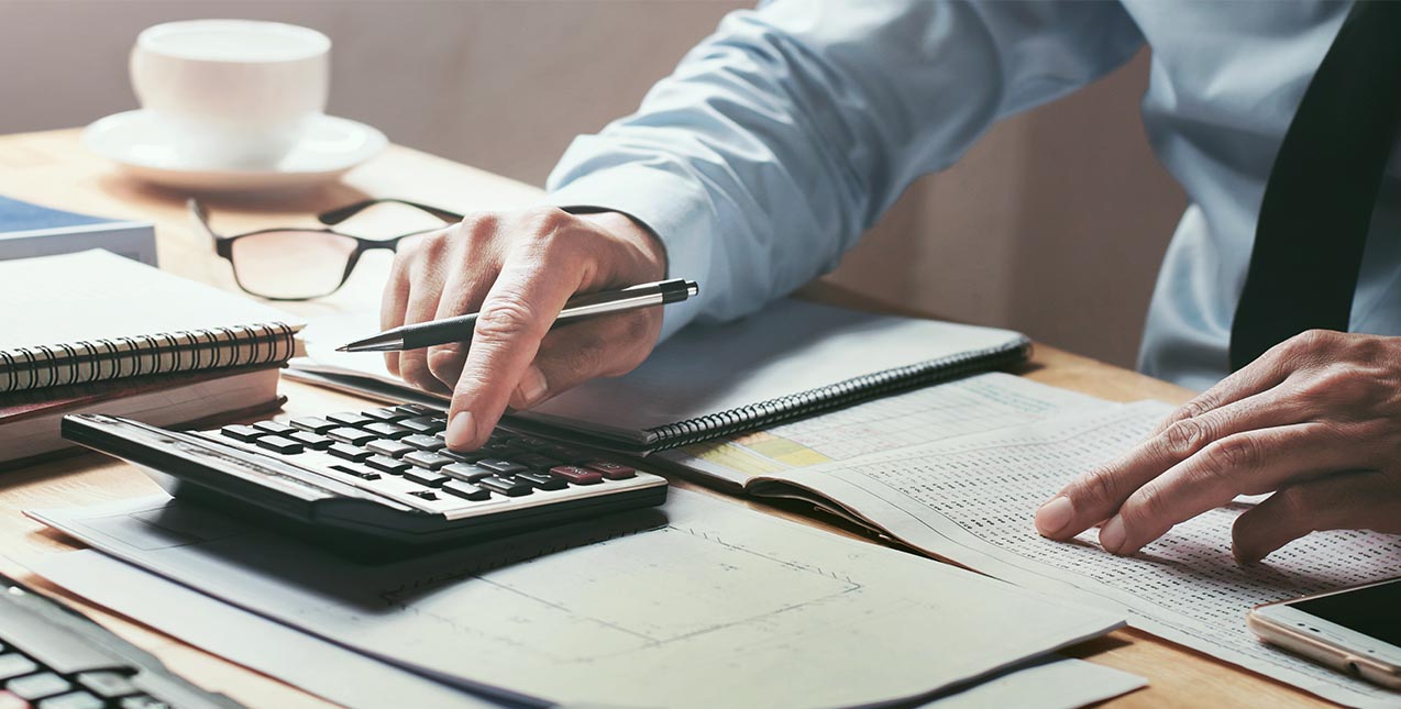 Business man calculating finances
